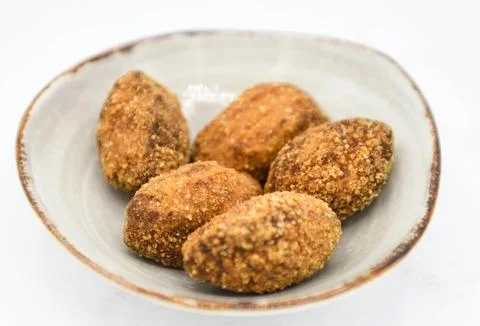Serving of assorted croquettes filled with chicken, ham and seafood Fotos de archivo