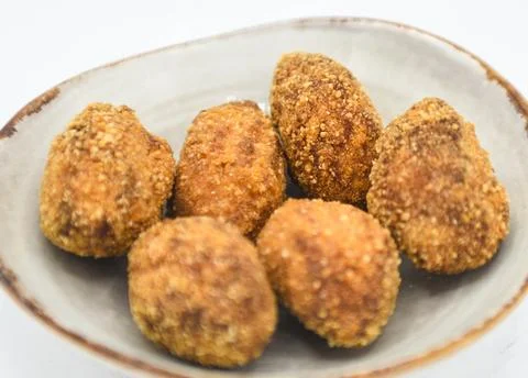 Serving of assorted croquettes filled with chicken, ham and seafood Stock Photos