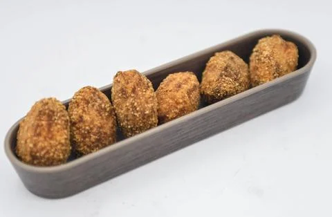 Serving of assorted croquettes filled with chicken, ham and seafood Fotos de archivo