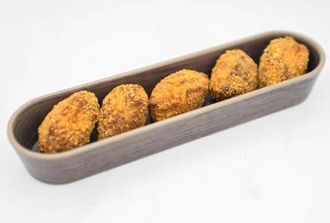Serving of assorted croquettes filled with chicken, ham and seafood Stock Photos