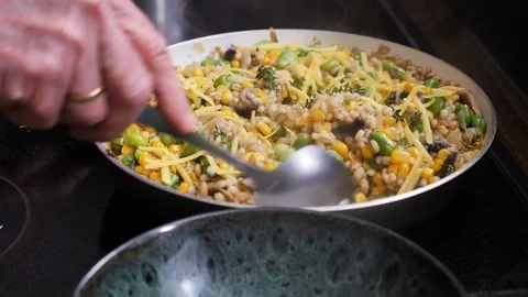 Serving Barley Risotto with Fava beans, Mushrooms and Corn Stock Footage 88111006