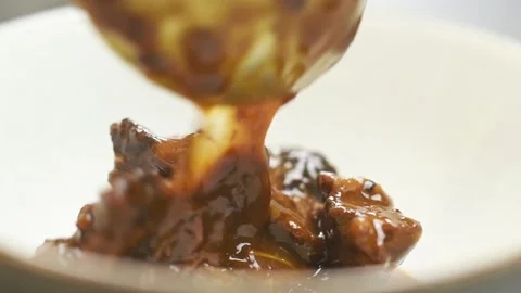 Serving beef stew with prunes. Video stock 159907658