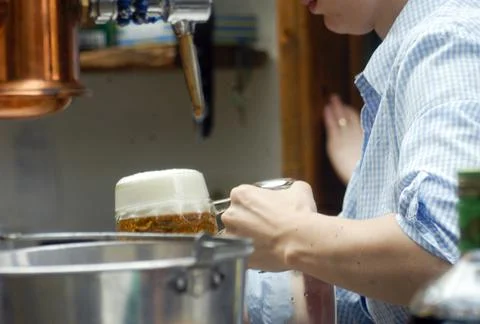 Serving a beer at a beer bar Stock Photos