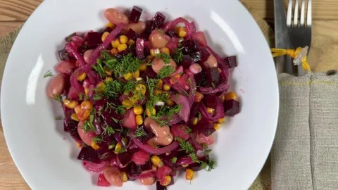 Serving of beetroot salad with beans, sweet corn and onion Stock Footage 271365173