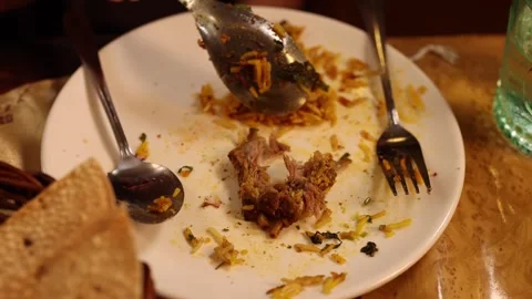 Serving Biryani Rice Onto a Messy Plate with Lamb Leftovers Stock Footage 346121449