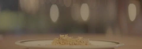 Serving biryani rice onto a white plate with a spoon. Stock-Footage 330241695