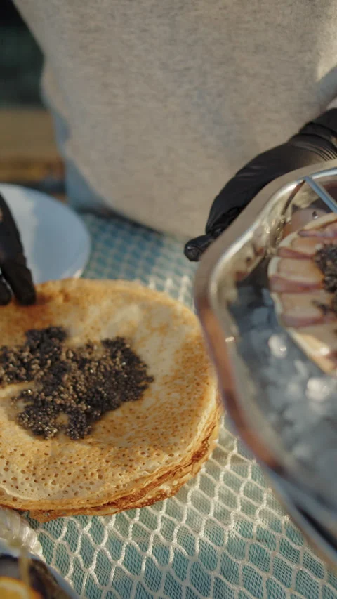 Serving black caviar on oyster shell over ice Stock Footage 310006592