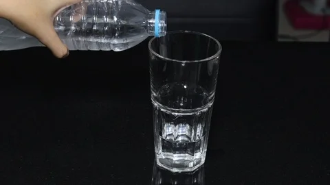 Serving bottle water glass motion Stock Footage 125083008