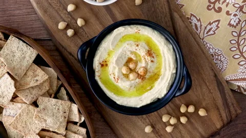 Serving a Bowl of Hummus Stock Footage 221366517