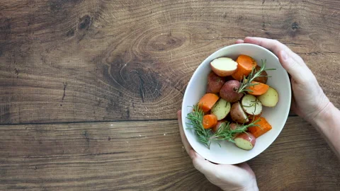 Serving a Bowl of Roasted Root Vegetables Stock Footage 162200601