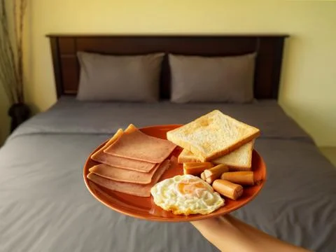 Serving breakfast in luxury bedroom Stock Photos