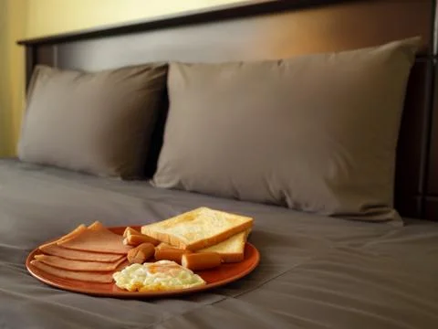 Serving breakfast in luxury bedroom Stock Photos