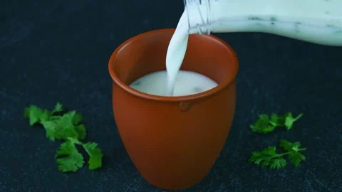 Serving buttermilk drink Stock Footage 308315739