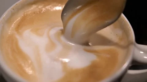 Serving Cappuccino Coffee Cup with Frothy Milk Latte Art Stock Footage 145261385