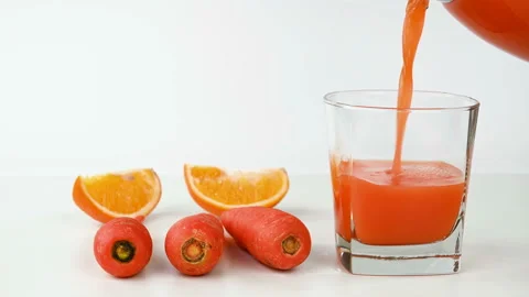 Serving carrot orange juice Stock Footage 224851235