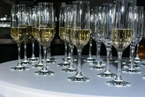 Serving champagne glasses at a solemn event. 스톡 사진