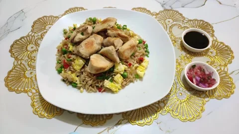 Serving of chicken and rice with egg called "Pollo con arroz". Food in Peru. 스톡 동영상 285361496