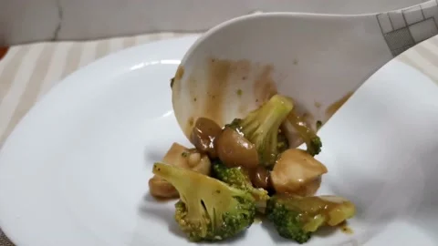 Serving Chicken Broccoli Mushroom on a Plate Stock Footage 234882775