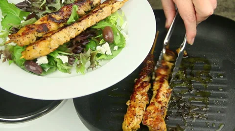 Serving Chicken Kebabs With Salad Stock Footage 39453565
