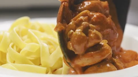 Serving chicken paprikash on a plate. Stock Footage 159402218