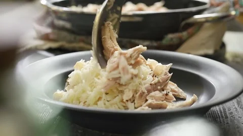 Serving chicken with rice on the plate. Stock Footage 240376706