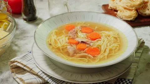 Serving the chicken soup Stock Footage 98375793