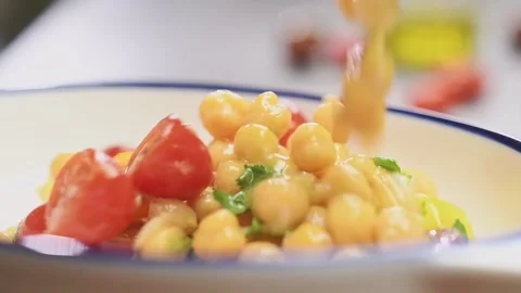 Serving chickpeas salad in a plate. Stock-Footage 159852784