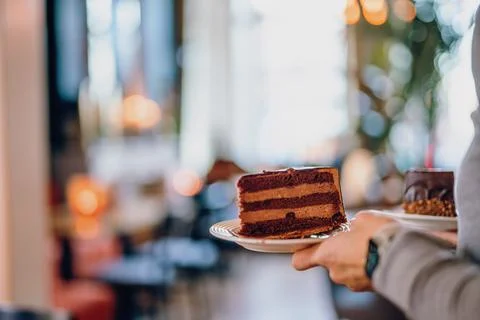 Serving chocolate cake  Stock Photos