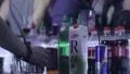 Serving cocktail drinks behind the night club bar HD Footage