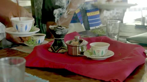 Serving coffee in Ethiopia with burning incense. Stock Footage 304440460