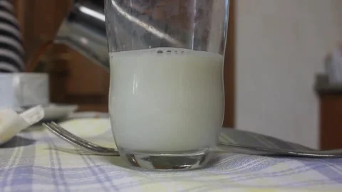 Serving coffee in a glass of milk Stock Footage 322026880