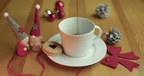 Serving coffee in a white cup on a wooden table with Christmas decorations. Stock Footage 221817984