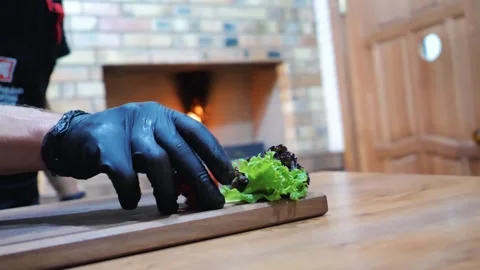 Before serving. the cook decorates the dish with vegetables before serving Stock Footage 248075071