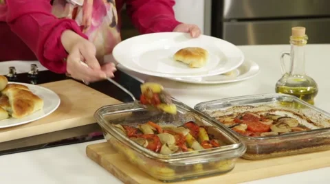 Serving of cooked dishes of baked vegetables and meat Stock Footage 49782650