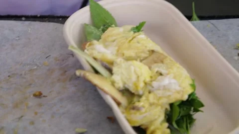 Serving Cooked Egg and Greens in Compostable Tray at Sydney Outdoor Market Stall Stock Footage 345709079