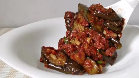 Serving Corned Beef with Eggplant Slices on a White Plate Stock Footage 241512014