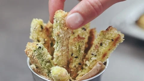 Serving crispy baked courgettes sticks. 스톡 동영상 150890059
