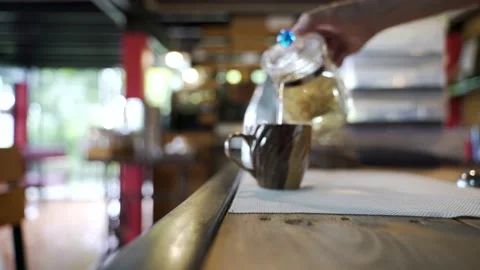 Serving cup of hot boiled flower tea Stock Footage 147336723