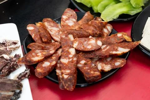 Serving of cured or preserved meat with mala as one of the ingredients in Stock Photos