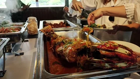 Serving a Delicious Fish Dish at a Buffet at Cruise Ship Stock Footage 279871324