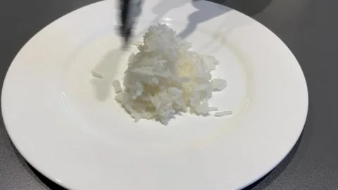 Serving Delicious Rice on a White Plate Stock-Footage 343865935