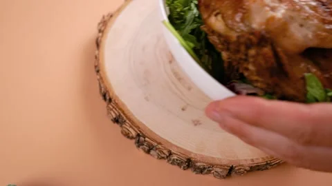 Serving a dish of fried chicken and herbs on the table. View from above. Stock Footage 250319028