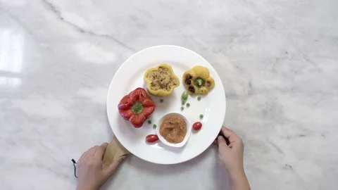 Serving a dish of pepper stuffed with spiced shrimp and rice, top view Stock Footage 134740063