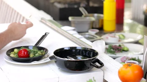 Serving a dish in a restaurant, the chef gives the order to the waiter Stock Footage 245587967