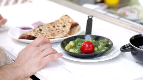 Serving a dish in a restaurant, the chef gives the order to the waiter Stock Footage 245587986