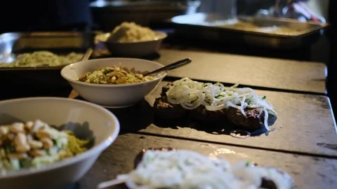 Serving a dish with shish kebab and chopped onions Stock Footage 241133546