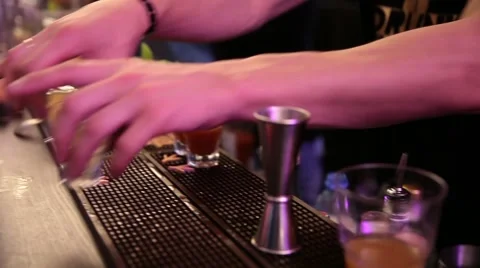 Serving drinks by bartender, people drink in bar Stock Footage 64766438