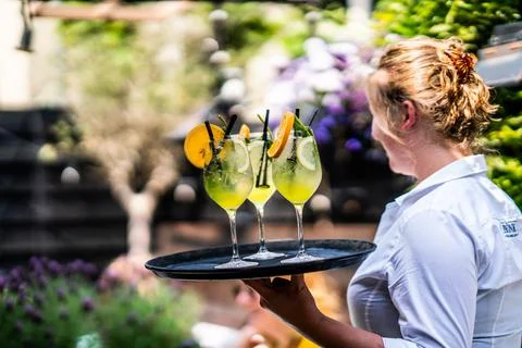 Serving drinks at a restaurant Stock Photos
