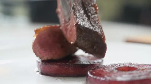 Serving duck breasts with glazed apples. Stock Footage 177568280