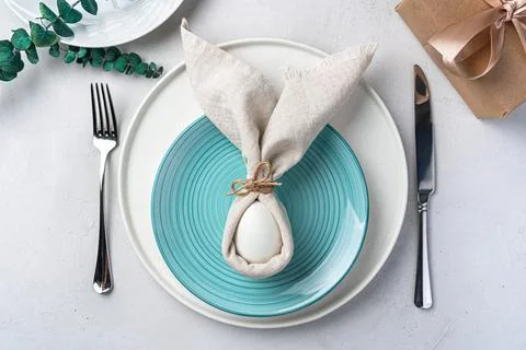 Serving the Easter table. The concept of a Happy Easter. Stock Photos